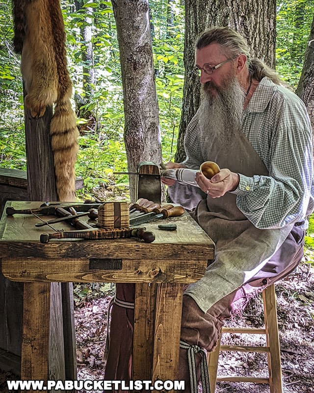 Artist Tim Sanner demonstrating the art of powder horn making at Mountain Craft Days in Somerset Pennsylvania.