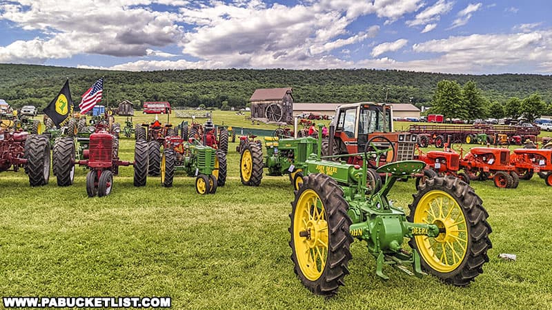 John Deere tractors are one of the more numerous makes of antique tractors on display at the Nittany Antique Machinery Show in Centre Hall Pennsylvania.