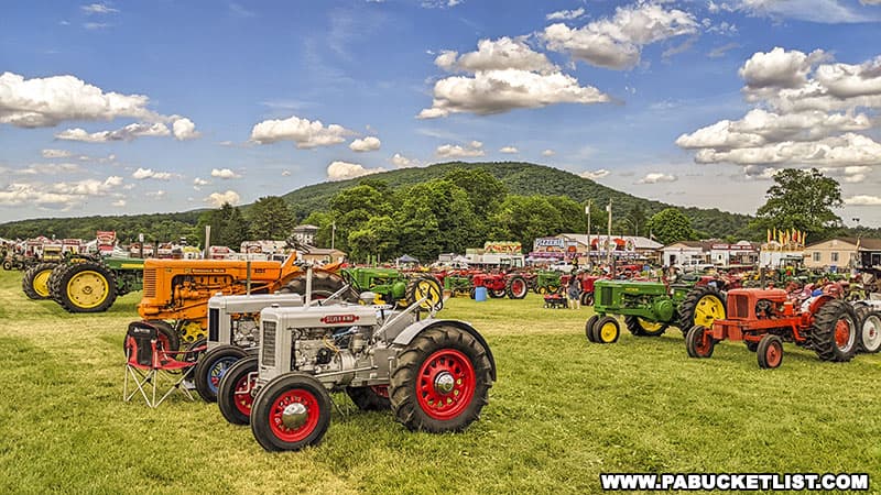The show field of vintage tractors at the Nittany Antique Machinery Show in Centre Hall Pennsylvania.