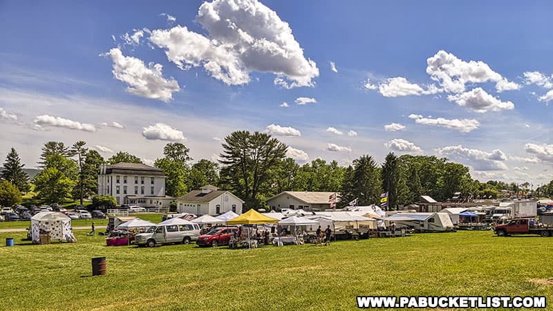 The flea market at the Nittany Antique Machinery Show takes place directly behind the historic Penn's Cave Hotel in Centre Hall Pennsylvania.