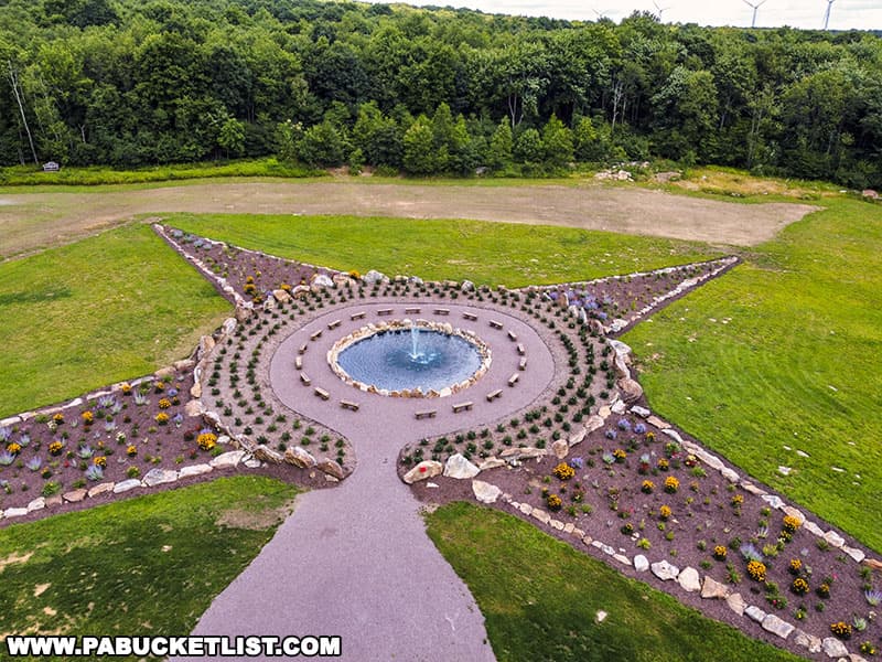 A 30-foot diameter fountain is located in the center of the compass design at the Remember Me Rose Garden near Shanksville in Somerset County Pennsylvania.