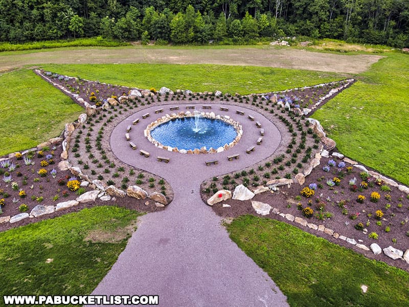 The compass-shaped Remember Me Rose Garden is filled with hundreds of perennials and more than 400"Julie Andrews” rose bushes.