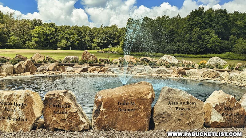 The names of the 40 heroes onboard Flight 93 are engraved on the rocks surrounding the fountain in the center of the Remember Me Rose Garden.