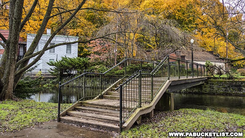 A footbridge connecting the Barnard Sculpture Garden to the peninsula at Talleyrand Park in Bellefonte Pennsylvania.