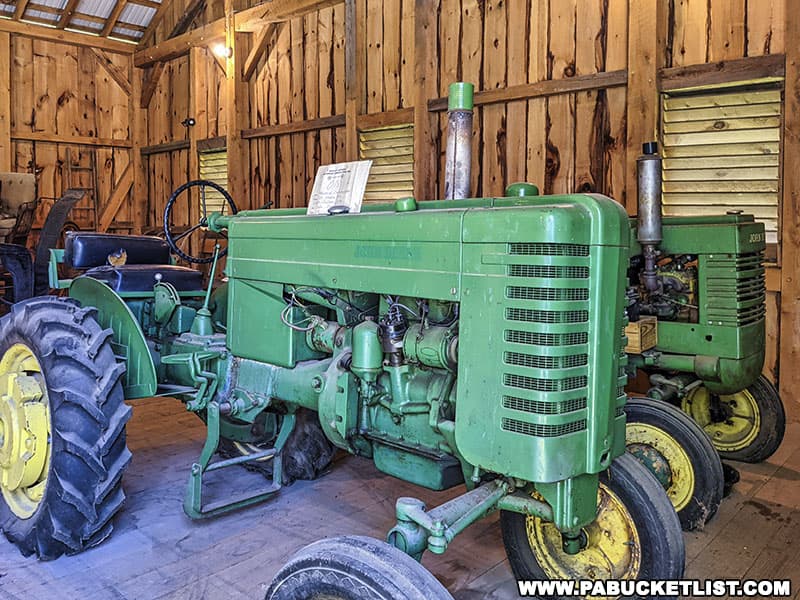 Vintage tractors on display inside the bank barn at the Boalsburg Heritage Museum.
