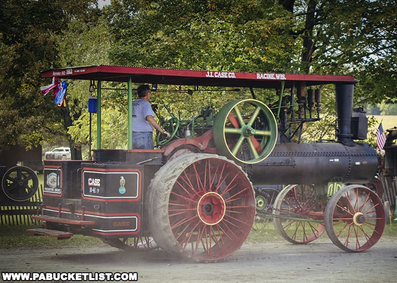 Case steam tractor on the move during the antique tractor parade at the Farmers and Threshermens Jubilee near Rockwood Pennsylvania.