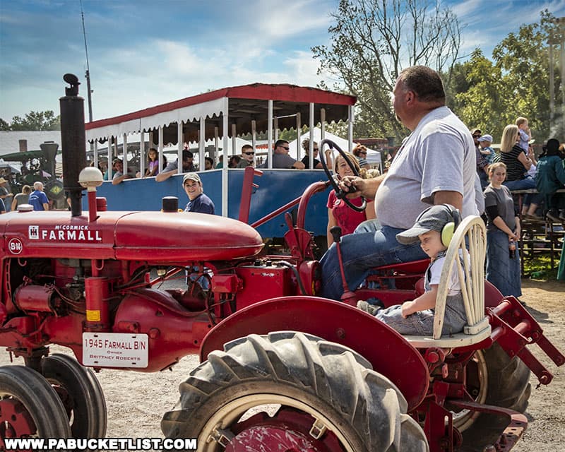 1945 Farmall in the antique tractor parade at the Farmers and Threshermens Jubilee in New Centerville Pennsylvania.