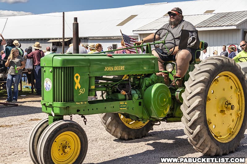John Deere in the antique farm tractor parade at the Farmers and Threshermens Jubilee in New Centerville Pennsylvania.
