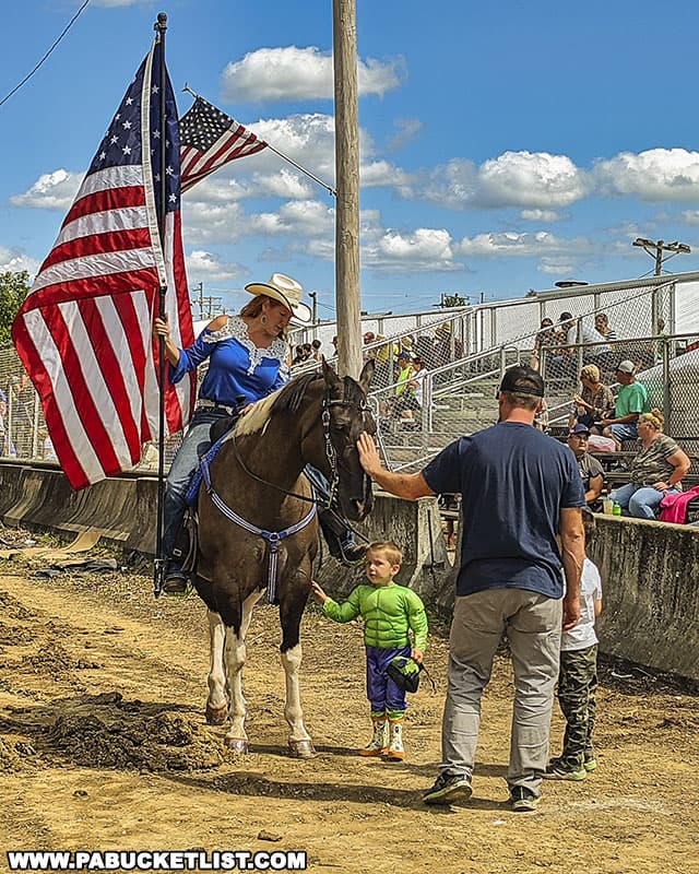 The Stars and Stripes on display before a horse-pulling contest at the Farmers and Threshermens Jubilee in Somerset County Pennsylvania.