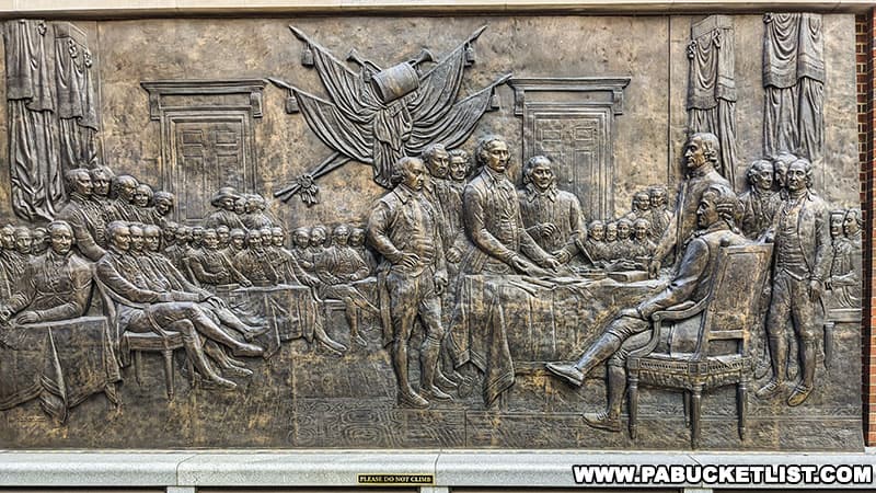Bronze sculpture outside the Museum of the American Revolution depicting the famous Declaration of Independence painting