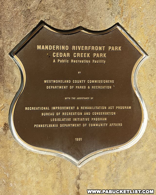 A Manderino Riverfront Park monument next to the parking area along the banks of the Youghiogheny River.