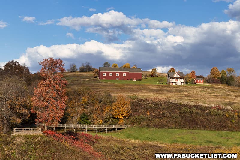 Fall foliage around the Unger House and barn-shaped Visitor Center at the Johnstown Flood National Memorial in Cambria County Pennsylvania.