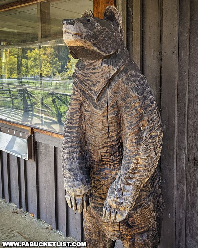 Chainsaw-carved bear next to the old Cook Forest State Park office along River Road.
