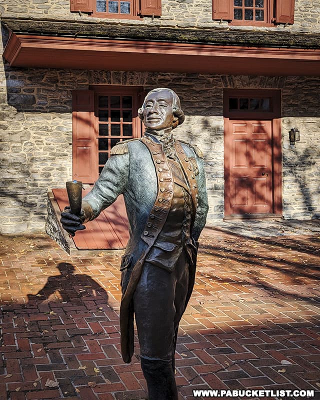 A sculpture depicting General Lafayette raising a toast in support of General George Washington and putting an end to the Conway Cabal.