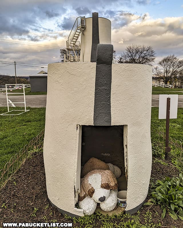 A stuffed dog now lives in the shoe-shaped doghouse behind the Haines Shoe House near York Pennsylvania.