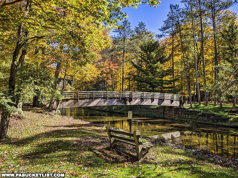 A bridge over Kettle Creek connecting the picnic area to a camping area at Ole Bull State Park. to a c