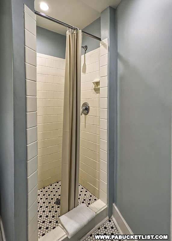 Tiled shower in a king suite bedroom at the Penn Wells Hotel in Wellsboro Pennsylvania.