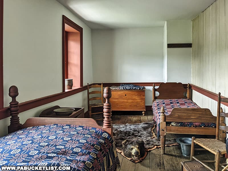A bearskin rug and chamber pots are two of the period-correct decorations in one of the bedrooms at the Compass Inn Museum in Westmoreland County Pennsylvania.