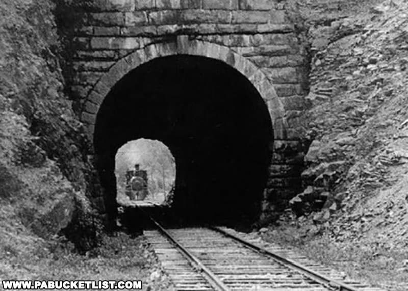 An eastbound train approaching the Coburn railroad tunnel.
