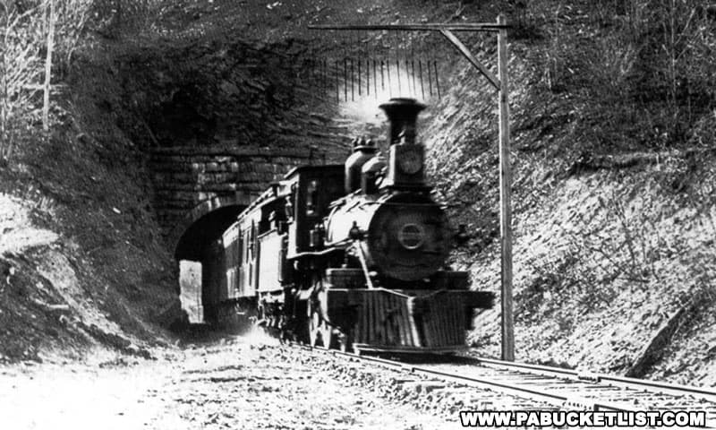 An eastbound train emerging from the Coburn railroad tunnel.