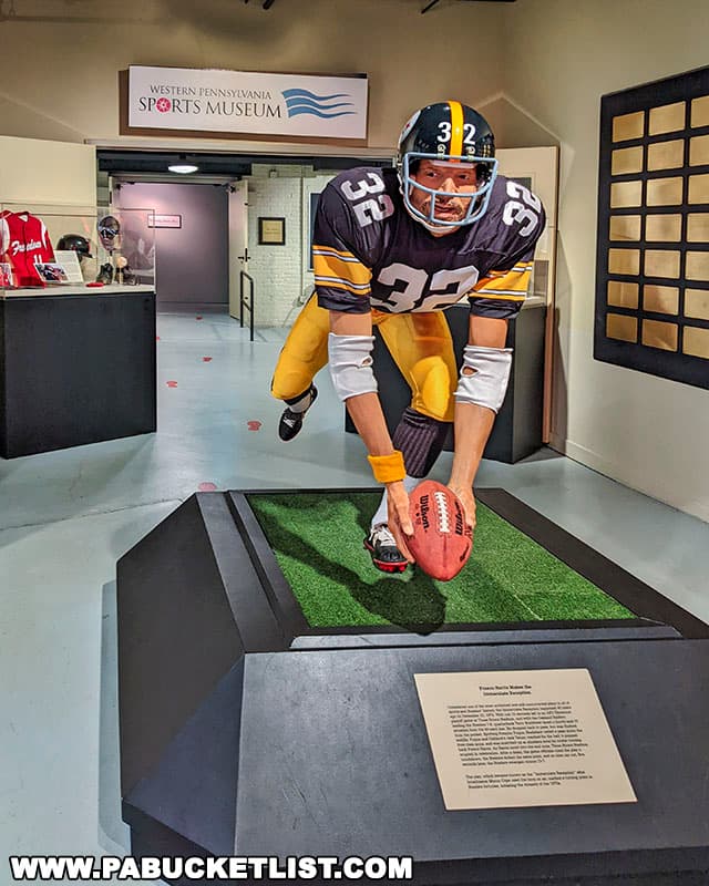 Statue of Franco Harris making the Immaculate Reception as you enter the Western Pennsylvania Sports Museum at the Heinz History Center in Pittsburgh Pennsylvania.