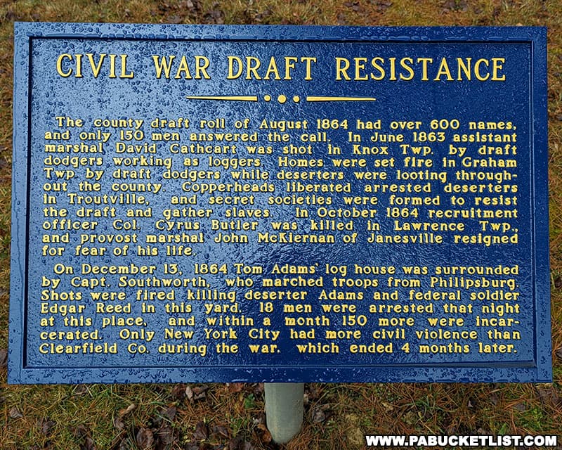 Civil War Draft Resistance historical marker in front of the Bloody Knox Cabin in Clearfield County Pennsylvania.