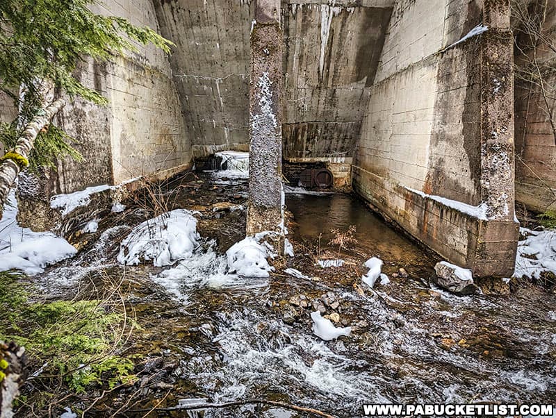 Kitchen Creek flows through a hole in the bottom of the abandoned Lake Leigh Dam at Ricketts Glen State Park.