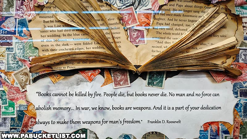 The "Books Cannot Be Killed By Fire" collage is composed primarily of postage stamps.