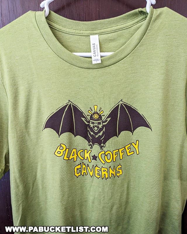 The Black-Coffey Caverns logo emblazoned on a t-shirt for sale in the visitor center.