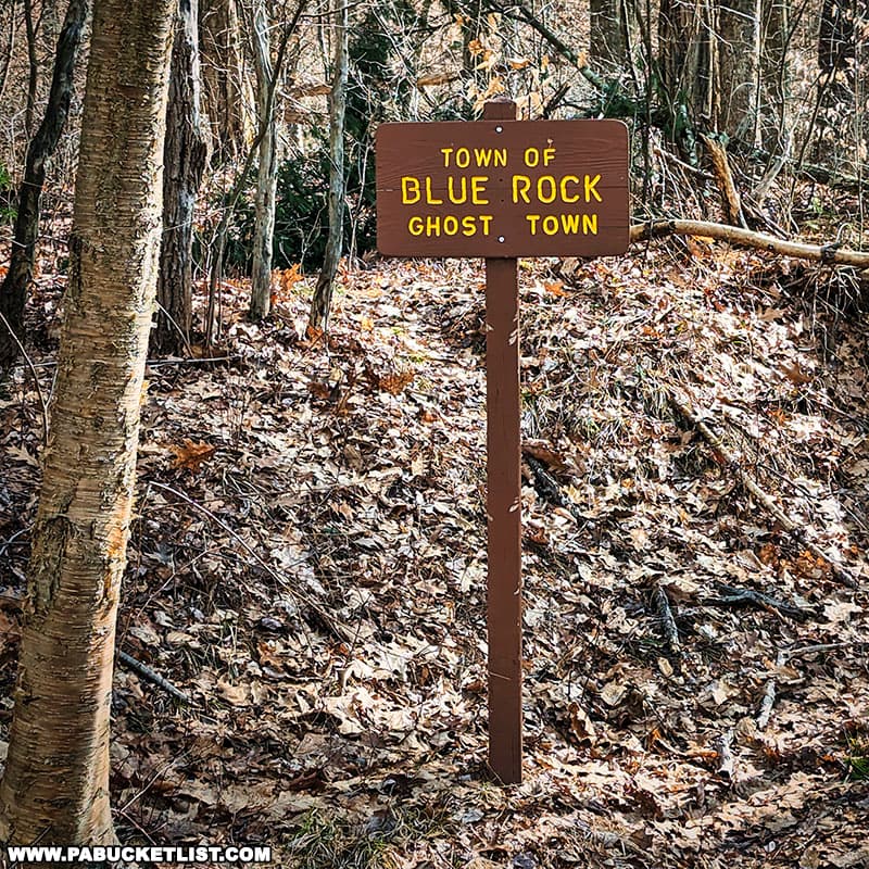 A sign denoting the location of Blue Rock on the eastern side of Little Toby Creek in Elk County Pennsylvania.