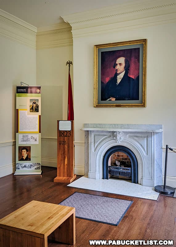 A portrait of Albert Gallatin over a fireplace at Friendship Hill.