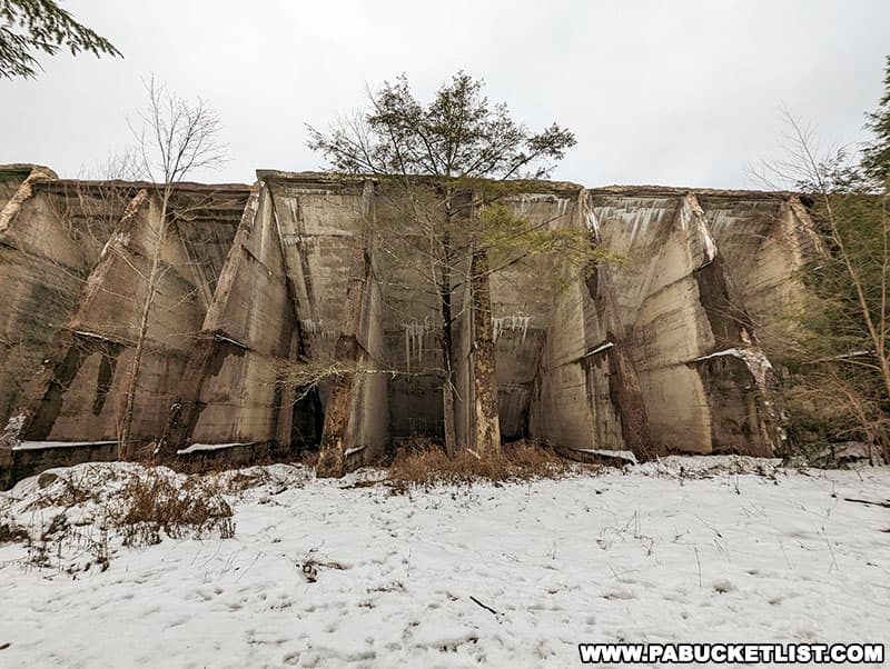The abandoned Lake Leigh Dam towers more than 30 feet above the surrounding terrain at Ricketts Glen State Park.