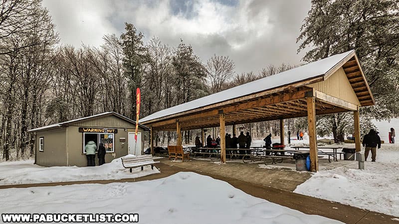The Warming Hut and picnic pavilion at the Sugarloaf sledding area at Ohiopyle State Park during a prior Winterfest.