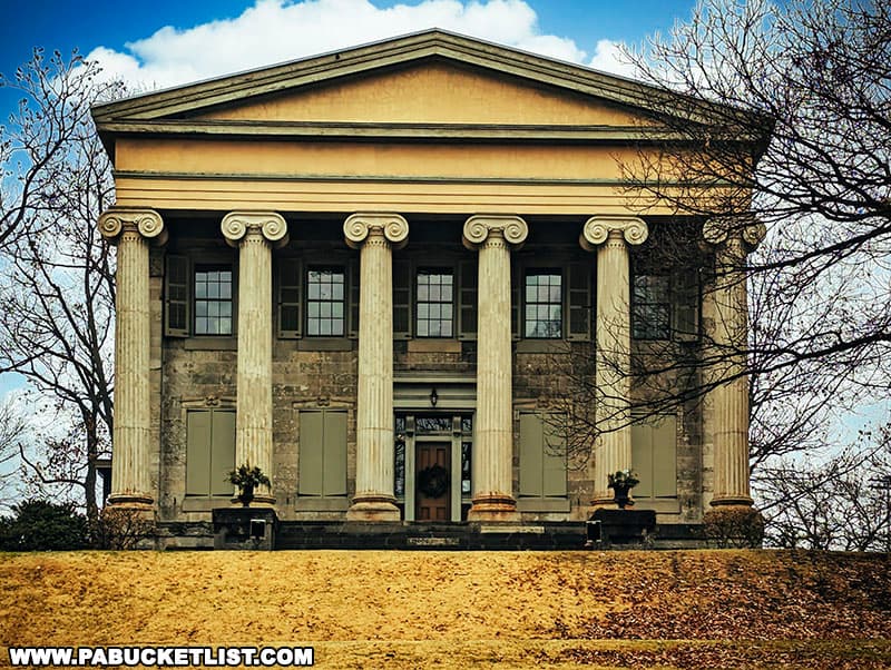 The front façade of the Baker Mansion in Altoona is five bays wide and features six fluted columns.