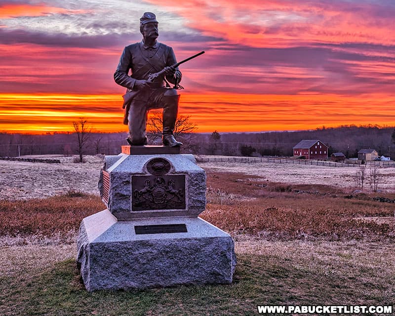 Sunrise over a monument dedicated to a division of the First Pennsylvania Cavalry at Gettysburg.