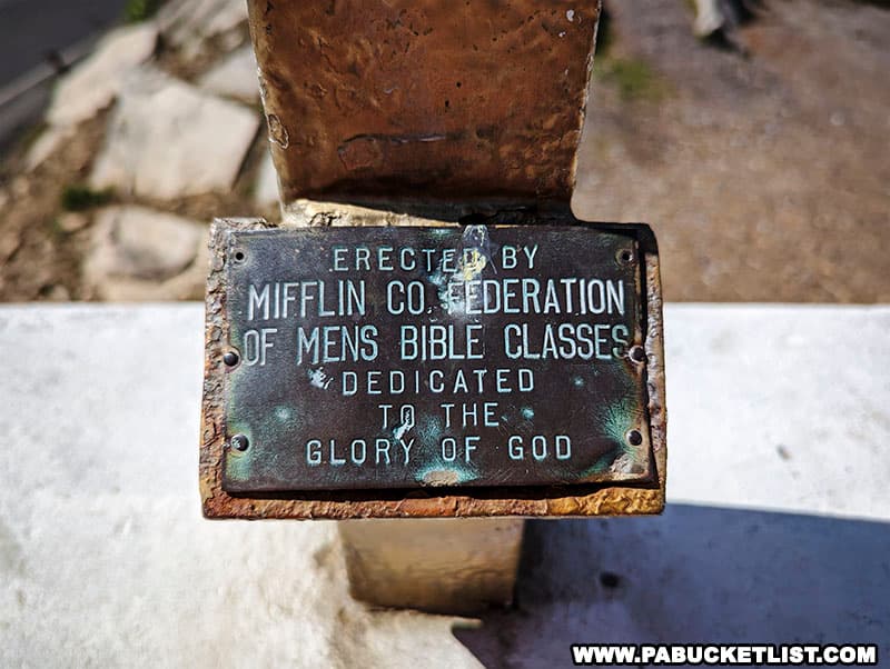 Dedication plaque on the base of the cross at Prayer Rock Scenic Overlook in Mifflin County Pennsylvania.