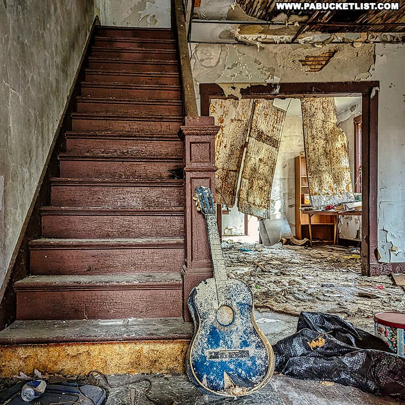 A blue guitar inside one of the homes at Yellow Dog Village.