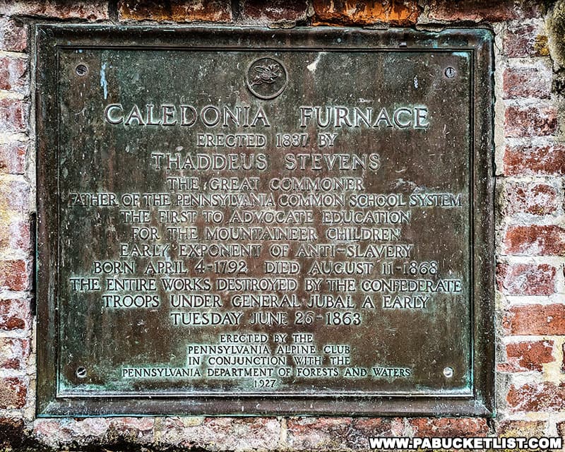 Historical plaque affixed to the replica of the Caledonia iron furnace stateck at Caledonia State Park in Franklin County Pennsylvania.