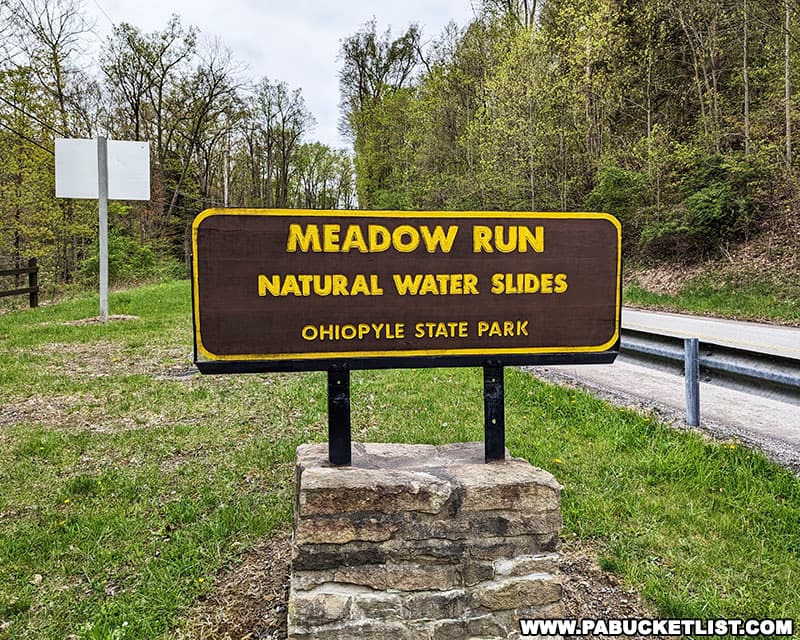 Meadow Run Natural Waterslides sign along Route 381 in Ohiopyle.