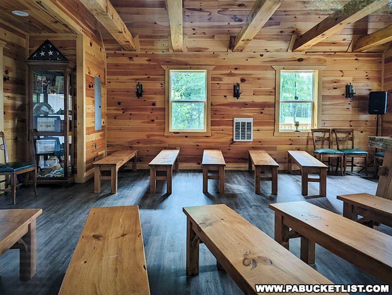 The interior walls of the chapel are made from hand-hewn white pine native to the area.