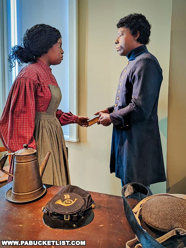 A diorama at the Seminary Ridge Museum featuring an African-American soldier preparing to leave to fight for the Union.