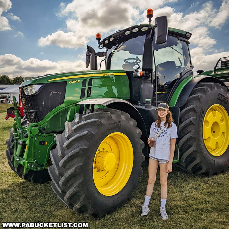 A large John Deere tractor on display at Penn State's Ag Progress Days in Centre County Pennsylvania.