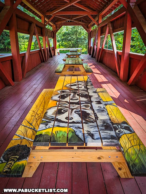 The East and West Paden Twin Covered Bridges are lined with mural-covered picnic tables.