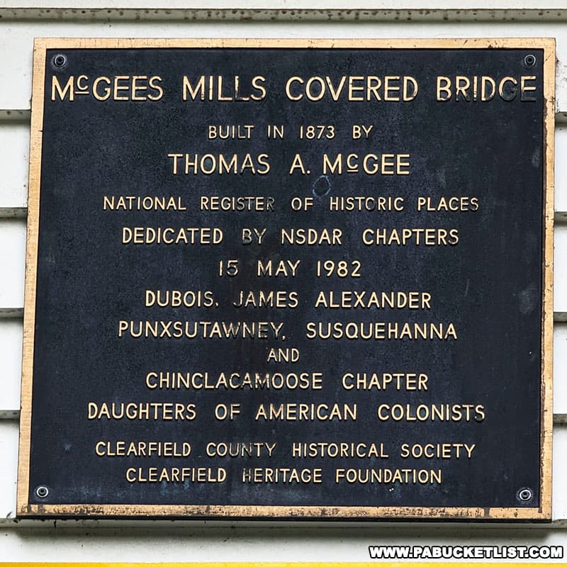 McGees Mills Covered Bridge plaque mounted on the bridge.