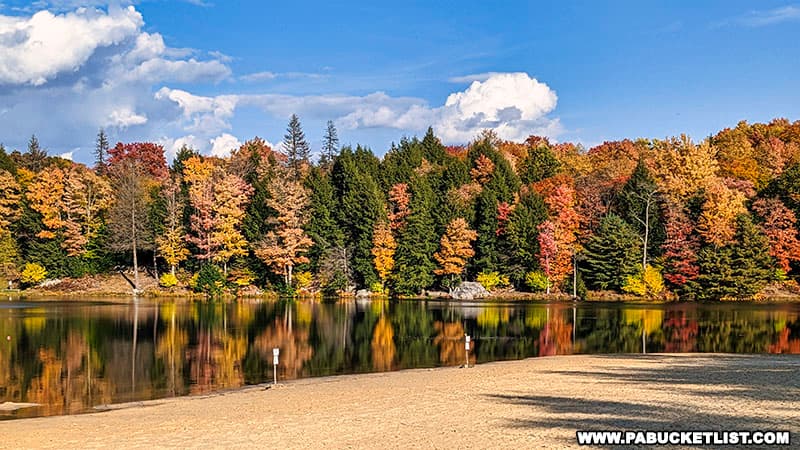Fall foliage reflections off the lake at Parker Dam State Park.