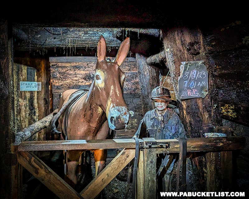 A diorama depicting a mule stable inside the Pioneer Tunnel coal mine.