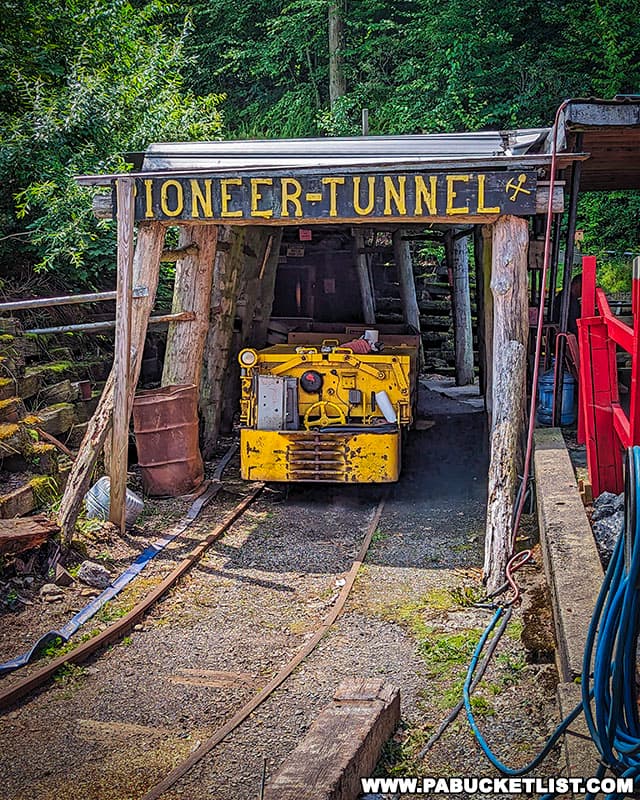 The trip into Pioneer Tunnel is made in an open mine car pushed or pulled by a battery-operated mine motor.