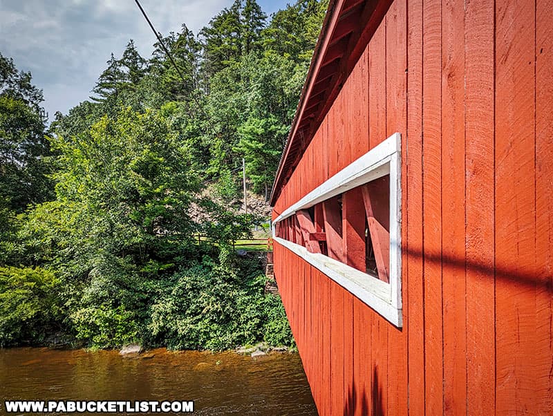 Both the East and West Paden Twin Covered Bridges feature a long window opening on their sides.