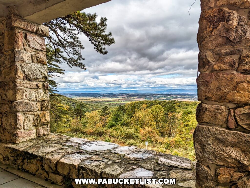 View from Cameron-Masland Mansion's stone overlook, with sweeping vistas of Cumberland County, Pennsylvania, under a dramatic cloudy sky.