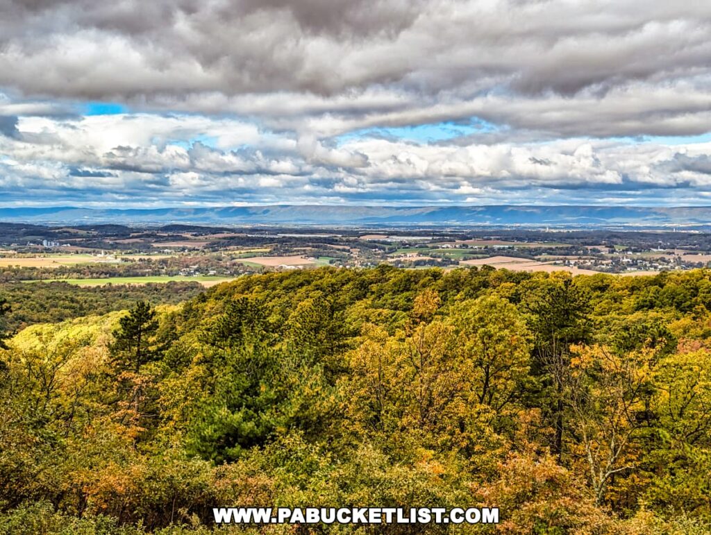 Panoramic view of the Cumberland Valley landscape with colorful autumn foliage and dramatic clouds from the Cameron-Masland Mansion.